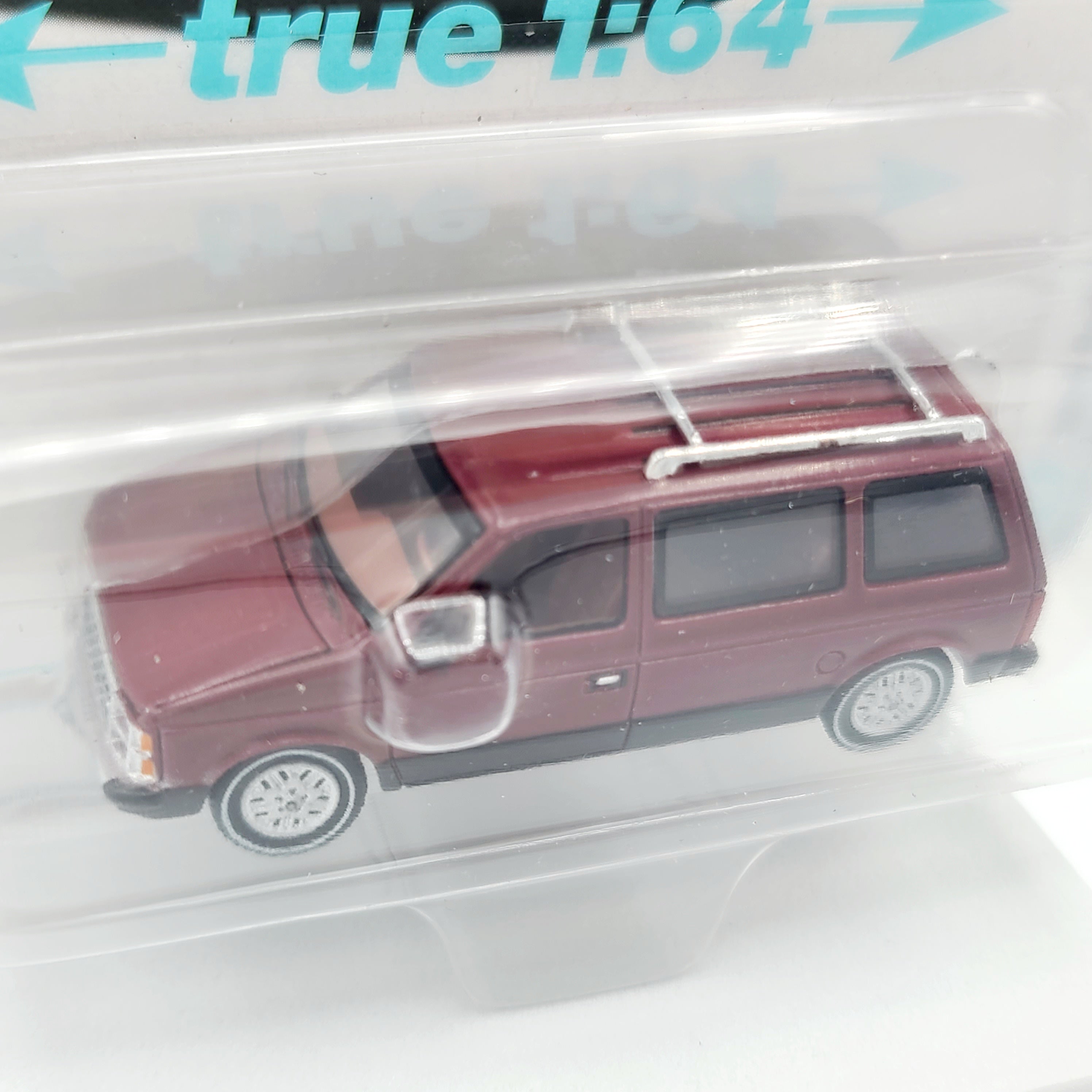 Auto World '85 Dodge Caravan - 1:64 scale (2024 Release 2B - Mighty Minivans)